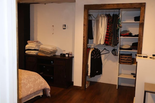 bedroom featuring dark wood-style floors