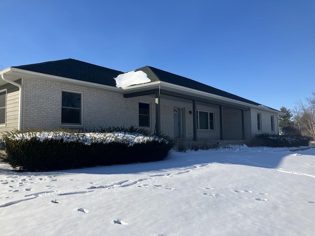 view of front of home featuring brick siding