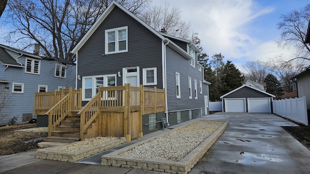 view of front of property with an outbuilding and a detached garage