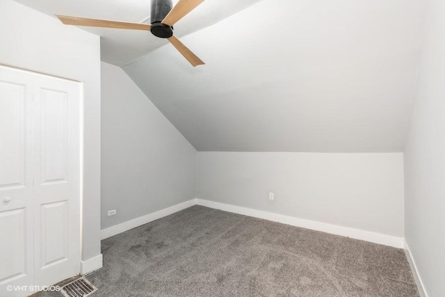 bonus room featuring vaulted ceiling, carpet, visible vents, and baseboards