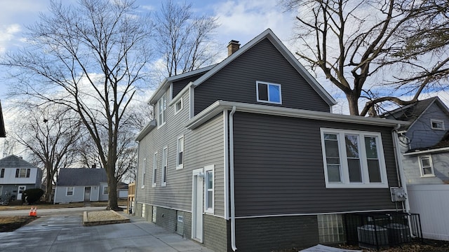 view of home's exterior with a chimney