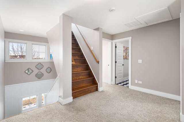 stairs featuring carpet flooring, attic access, and baseboards