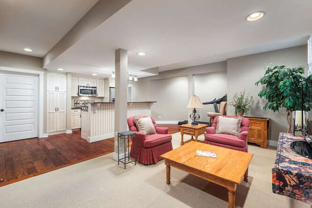 living area with recessed lighting and baseboards