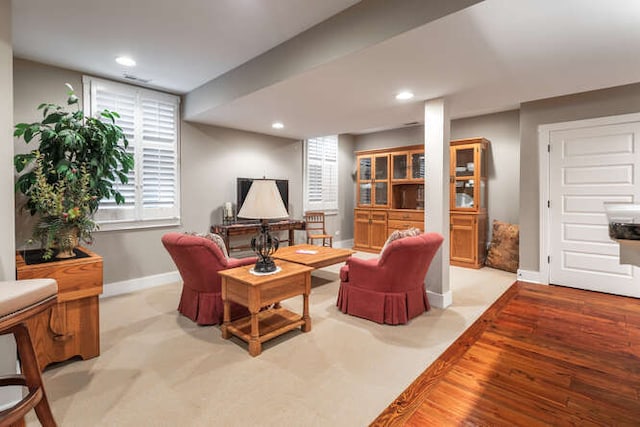 living room featuring recessed lighting, light wood-style flooring, and baseboards