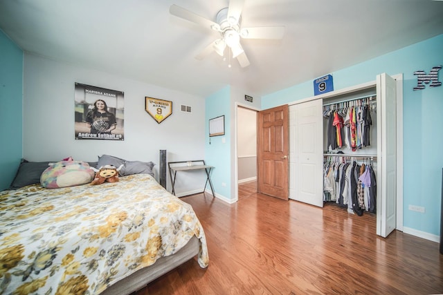 bedroom with ceiling fan, a closet, baseboards, and wood finished floors