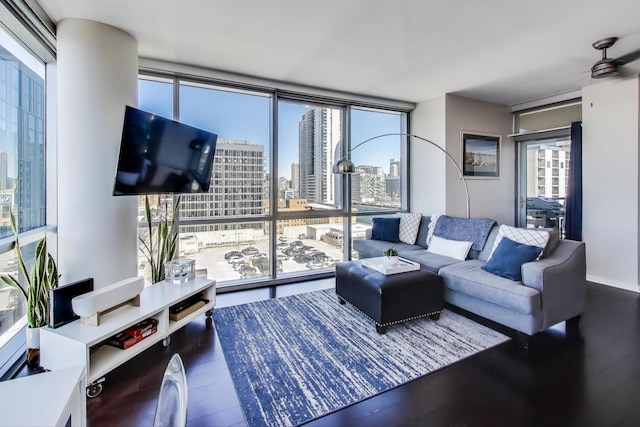 living room featuring expansive windows and wood finished floors