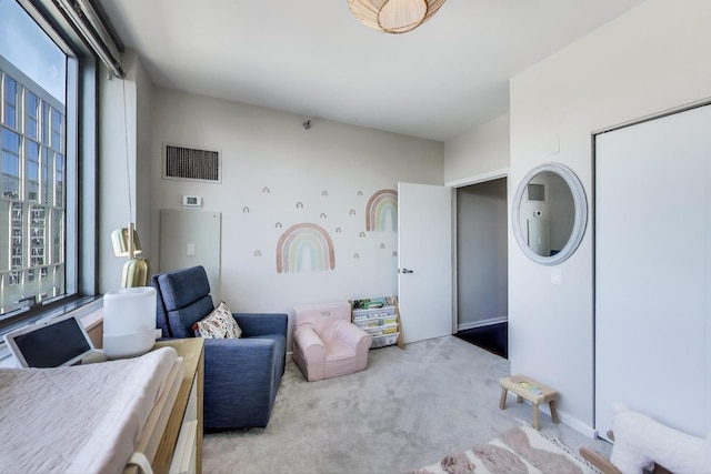 bedroom featuring light colored carpet and visible vents