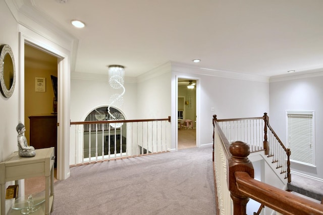 hallway with crown molding, recessed lighting, carpet flooring, an upstairs landing, and baseboards