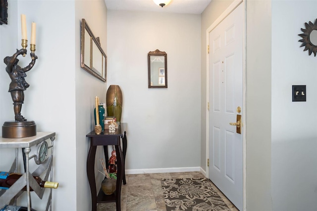 foyer entrance with baseboards