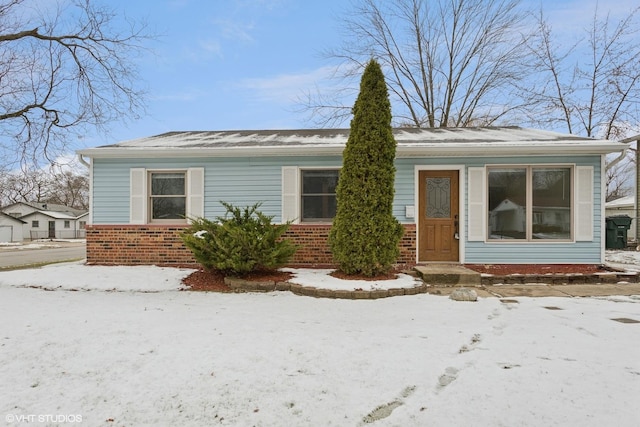 view of front of property featuring brick siding