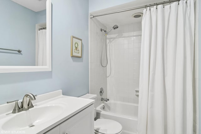 full bathroom with toilet, shower / tub combo, and vanity