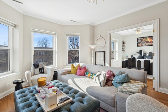 living room with baseboards, dark wood finished floors, and ornamental molding