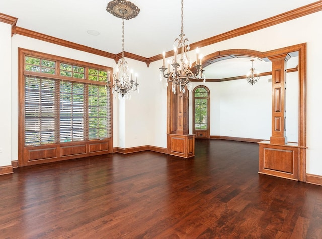 unfurnished room with dark wood-style floors, arched walkways, a notable chandelier, and baseboards