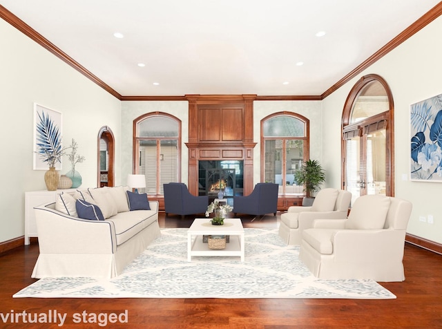 living room with recessed lighting, a fireplace, baseboards, dark wood finished floors, and crown molding