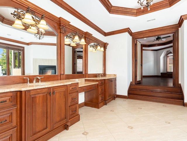 bathroom featuring visible vents, a tray ceiling, a chandelier, and ornamental molding