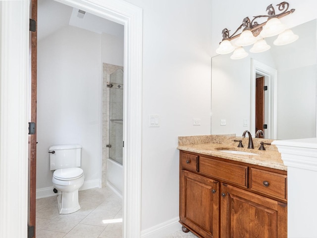 bathroom with toilet, vanity, baseboards, and tile patterned floors