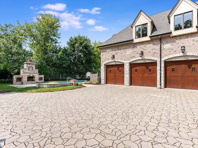 garage with a fireplace