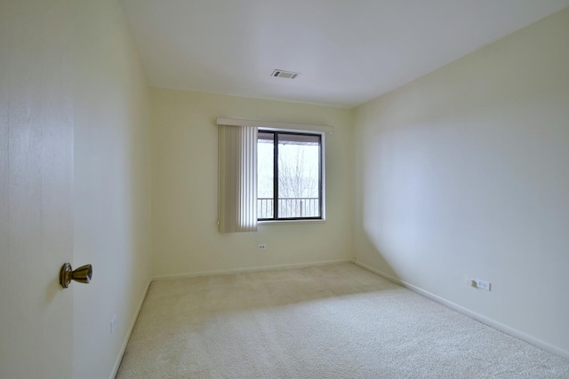 unfurnished room featuring light carpet, baseboards, and visible vents