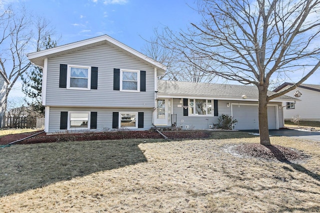 split level home featuring driveway and a garage