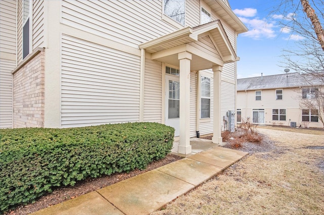 doorway to property with a chimney