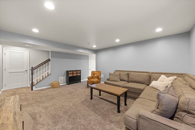 carpeted living room with baseboards, stairway, visible vents, and recessed lighting