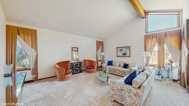 carpeted living room with high vaulted ceiling, beam ceiling, and plenty of natural light