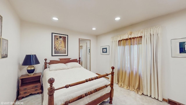 bedroom with recessed lighting, light colored carpet, and visible vents