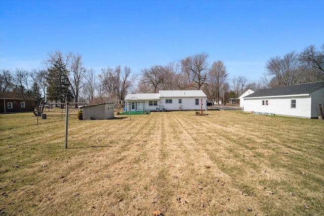 view of yard with a shed and an outdoor structure