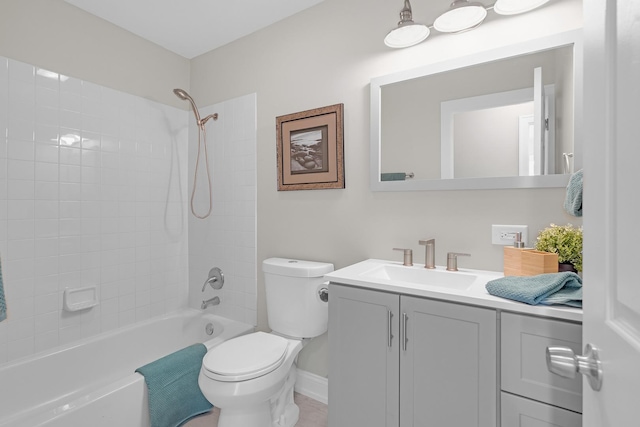 bathroom with toilet, baseboards, shower / washtub combination, and vanity