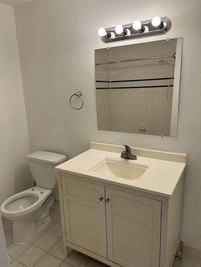 bathroom featuring toilet and vanity