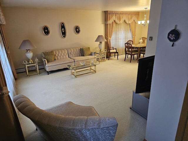 carpeted living area featuring a baseboard heating unit and a notable chandelier