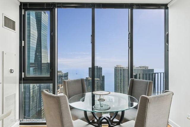 225 N Columbus Dr Unit 5610, Chicago, IL 60601 - dining area with expansive windows and a view of city