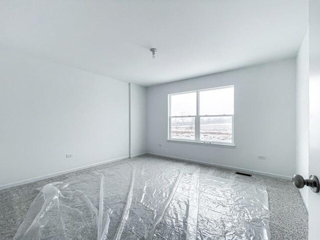 1571 Glenbrooke Ln, New Lenox, IL 60451 - spare room featuring baseboards and visible vents