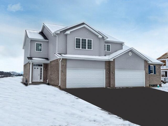 1571 Glenbrooke Ln, New Lenox, IL 60451 - traditional-style home with aphalt driveway and brick siding