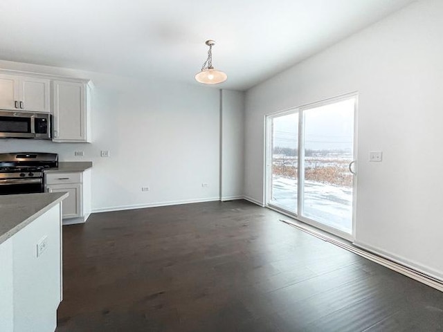 1571 Glenbrooke Ln, New Lenox, IL 60451 - kitchen featuring baseboards, dark wood finished floors, appliances with stainless steel finishes, white cabinetry, and pendant lighting