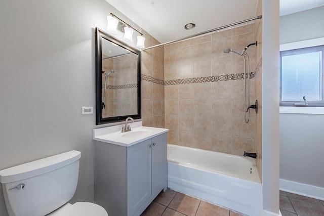 full bath with tile patterned flooring, shower / bathing tub combination, vanity, and toilet