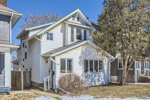 traditional-style house with a shingled roof