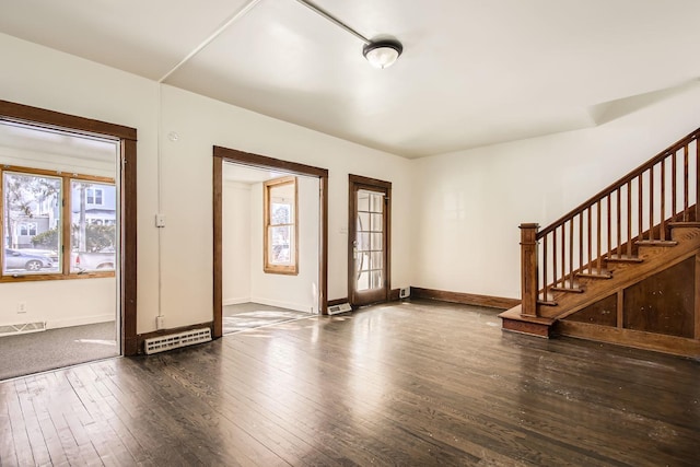 entryway featuring dark wood-style flooring, visible vents, stairway, and baseboards