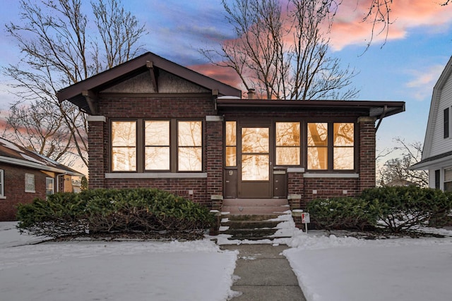 view of front of house with brick siding