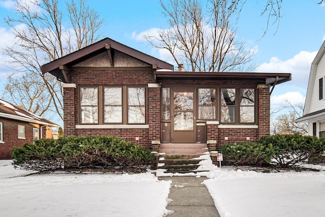 view of front of property featuring entry steps and brick siding