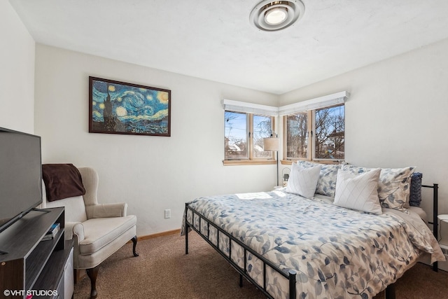 bedroom featuring carpet and baseboards