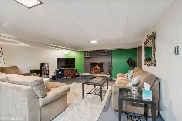 living room with a brick fireplace