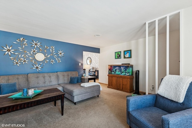 living area featuring carpet flooring and baseboards