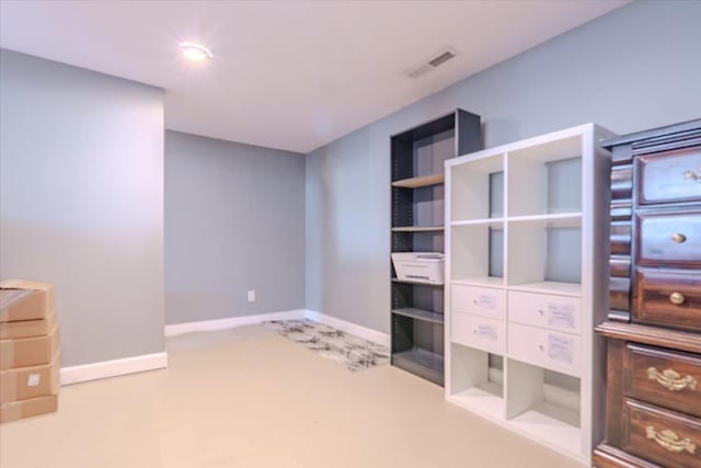 interior space featuring carpet floors, baseboards, and visible vents