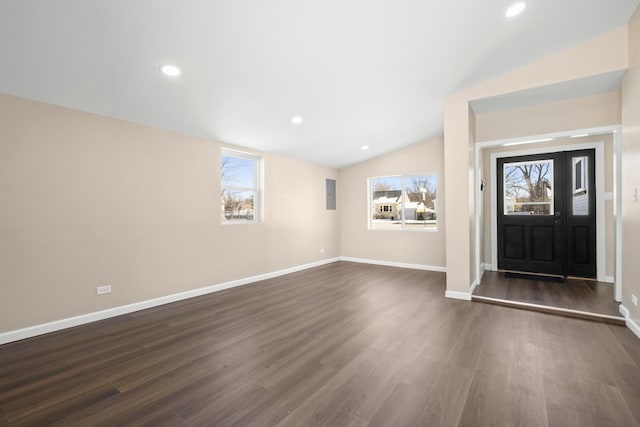 entryway with dark wood-type flooring, lofted ceiling, baseboards, and recessed lighting