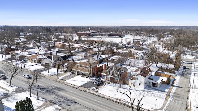 snowy aerial view with a residential view