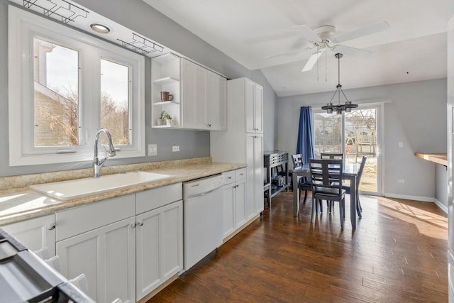 kitchen featuring dishwasher, open shelves, a sink, and white cabinetry