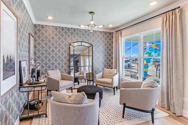 living room featuring a chandelier, light wood-style flooring, recessed lighting, baseboards, and wallpapered walls