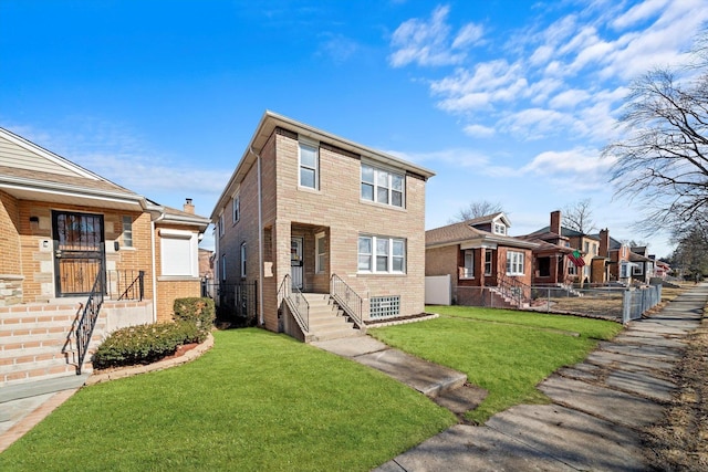 view of front of home featuring a front yard, brick siding, fence, and a residential view