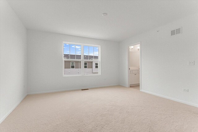 1121 Girard Ave, Des Plaines, IL 60018 - spare room featuring light carpet and baseboards